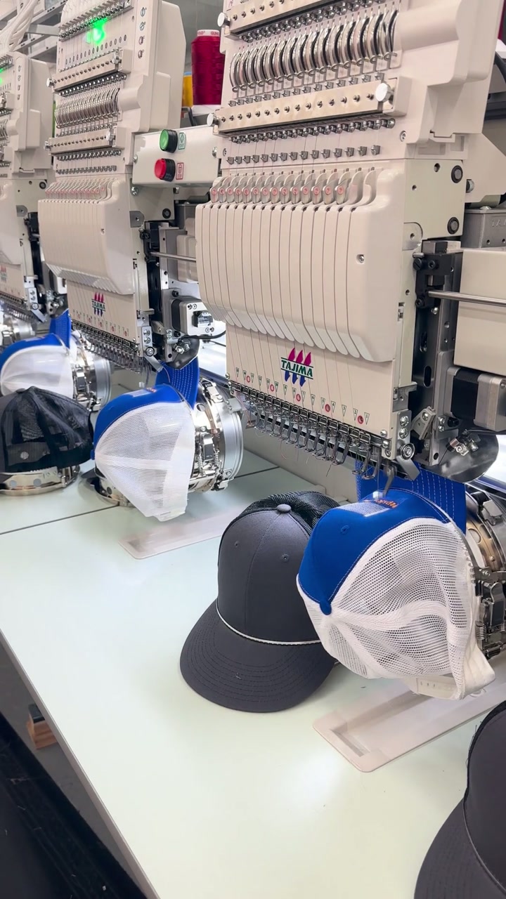 Tajima embroidery — caps on 12-head
